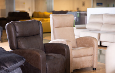 Two cozy armchairs in furniture showroom