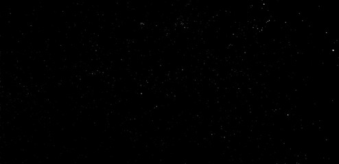 Obraz premium Snow, stars, twinkling lights, rain drops on black background. Abstract vector noise. Small particles of debris and dust. Distressed uneven grunge texture overlay.