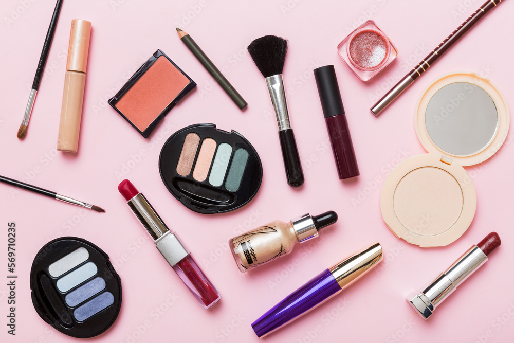 Wall mural Professional makeup tools. Top view. Flat lay. Beauty, decorative cosmetics. Makeup brushes set and color eyeshadow palette on table background. Minimalistic style