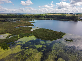Aerial vIew of Khodoriv city by drone. Summer Ukraine Lviv region, West Ukraine. Lake.