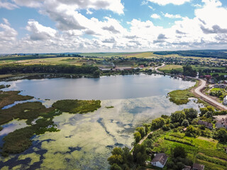 Fototapeta na wymiar Aerial vIew of Khodoriv city by drone. Summer Ukraine Lviv region, West Ukraine. Lake.