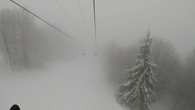 Timelapse funicular to Mount Hymba. Pylypets ski resort in the Carpathians of Ukraine. Prepared tracks for skiers and snowboarders. The longest ski track in Ukraine. Cable car - Borzhavski lifts