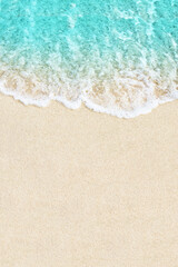 Fototapeta na wymiar Soft ocean wave on white sand beach background