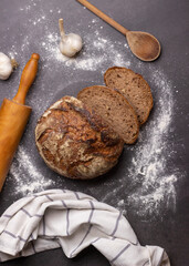 Handmade traditional bread, on the table with garlic, cloth and rolling pin, food concept, Flat lay, bakery