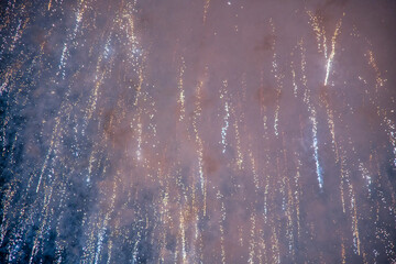 New Year's Eve fireworks. Gold and dark blue Fireworks and bokeh and copy space. Abstract background holiday