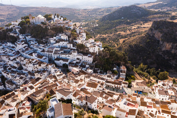 Spectacular view from drone of old white-washed houses of clifftop village of Casares at sunny day, Spain