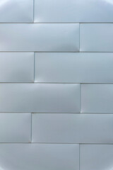 Close up view of a smooth shiny surface wall at the exterior of a building. City views in Austin Texas with focus on a wall with modern architecture and geometric design.