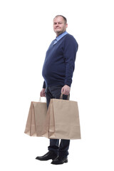 in full growth. casual mature man with shopping bags.