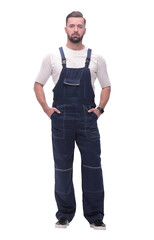 in full growth. smiling man in overalls.