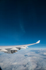 Fototapeta premium flying and traveling. Airplane interior or jet window with clouds and sky. Sky view from a high angle on the plane. 
