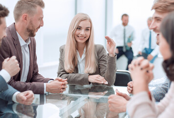 young businesswoman explaining new tasks at a working meeting.