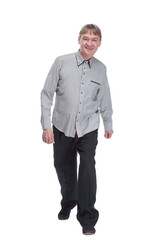 happy mature man in white shirt striding forward.