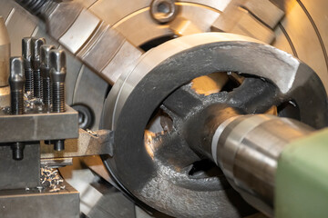 The operation of  lathe machine. cutting the cast iron material parts.