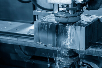 Closeup scene the wire EDM machine cutting the mold insert parts.
