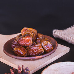 Delicious Date Fruit in a bowl. Bowl of dried dates.