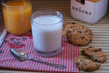 Glass of Milk with Orange Juice and Cookies