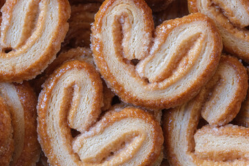 Background with puff pastry and sugar apricots texture