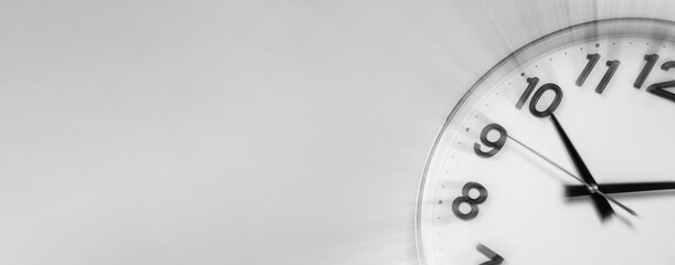 Fleeting time concept. Clock on light grey background, motion effect. Banner design with space for text