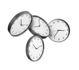 Many stylish clocks falling on white background