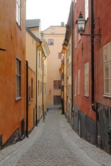 Fototapeta na wymiar narrow colorful street in Stockholm, Sweden