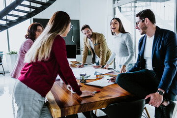 Group of young hispanic people of architects or Designer teamwork planning and working on interior design project or architecture development in a creative office in Mexico Latin America top view