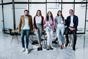 group of young hispanic business people or teamwork working in casual clothes at office in Mexico...