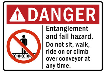 Machine hazard sign and labels entanglement and fall hazard. Do not sit, walk, ride on or climb over conveyor at any time