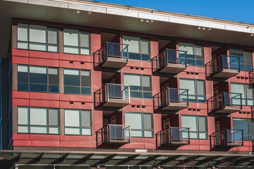 Modern apartment buildings on a sunny day with a blue sky. Facade of a modern apartment building. New apartment building