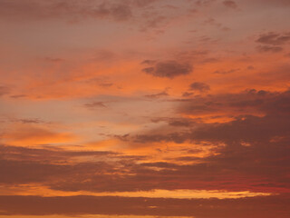 Fototapeta premium Sunset on the beach, golden hour, the sky is painted in orange and yellow colors