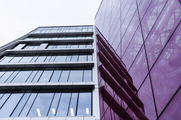 modern skyscraper made of glass and concrete.