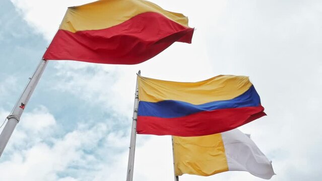 Colombian, Vatican and flag of Bogota in Monserrate. Slow motion