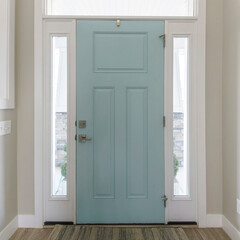 Square Mint front door interior with transom window and sidelights. Interior of a house with light...