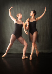 Obraz premium Two young female ballet dancers perform in a Connecticut studio.