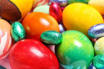 Colorful Easter eggs and candies, closeup
