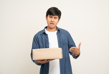 Young feel bad confused asian man with many parcel cardboard standing on isolated white background....