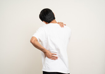 Young Asian man has problem with structural posture He had neck and shoulder pain. Massaged his neck and shoulders for relief. reduce muscle tension. Standing on isolated white background