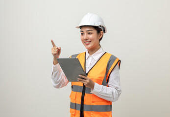 Asian engineer worker woman or architect with white safety helmet standing on isolated white background. Mechanic service factory Professional job occupation in uniform working with tablet