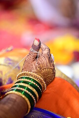 White thread around finger of Indian Bride in wedding ceremony. Maharashtra traditional wedding...