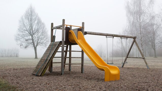 Playground on foggy morning in the park,