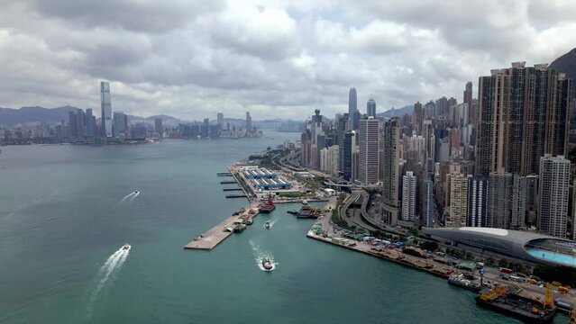 Harbour view of Hong Kong island. Skyscrapers and ferries. Popular tourism and financial destination in Asia. China. High-risers and residential buildings. 
