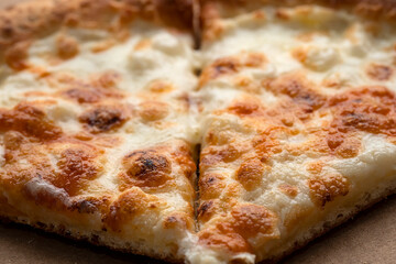 Pizza with ham in an open cardboard box. High quality photo