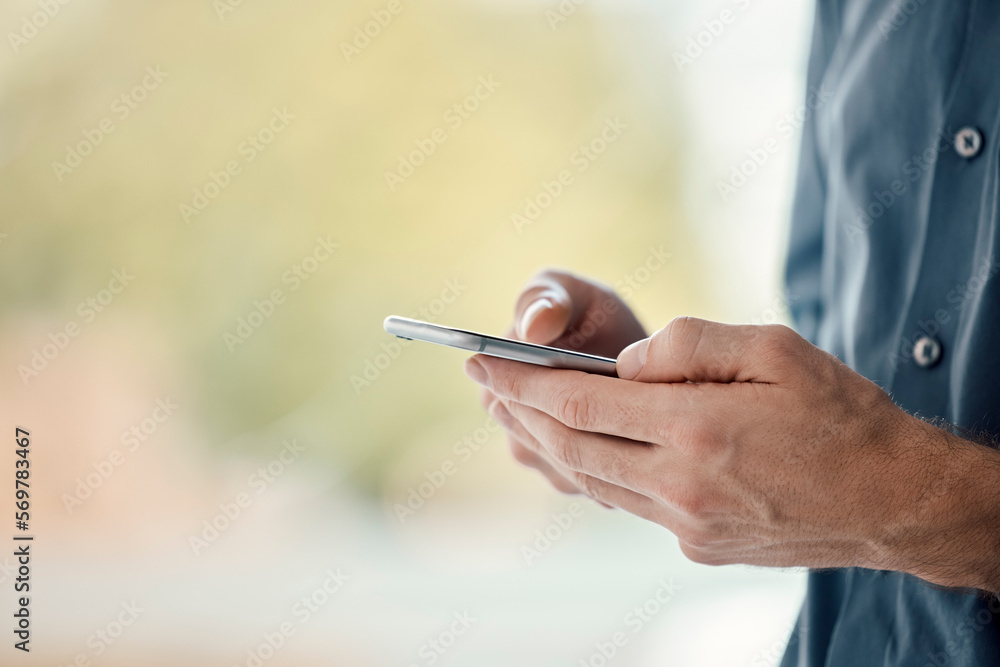 Poster Man hands, phone and mobile networking of a businessman in a office on web. Online communication, text writing and technology of a social media writer employee with mock up and blurred background