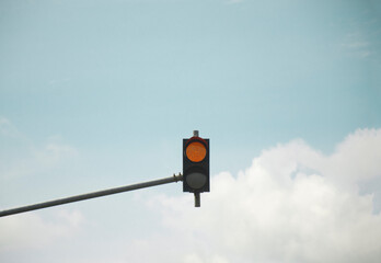Low Angle View Of Stoplight Against Blue Sky in a Sunny Day