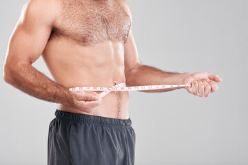 Health, fitness and man with measuring tape on waist, healthy diet and exercise for body care....