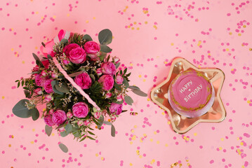 Trendy pink and gold festive Korean bento cake on a golden plate in the shape of a star on a pink...