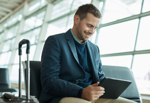 Airport travel, tablet or business man review finance portfolio, stock market database or investment feedback. Economy, forex account manager or trader happy for NFT, bitcoin or crypto trading profit - Powered by Adobe