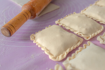 Puff pastry. Sweet baking. Molded dough products. Homemade pies. Cozy still life. Dessert baking. Grocery store. Sculpt from the dough.