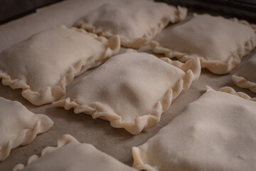 Puff pastry. Sweet baking. Molded dough products. Homemade pies. Cozy still life. Dessert baking. Grocery store. Sculpt from the dough.