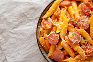 Homemade One-pot Hot Dog Pasta in a Bowl, top view. Flat lay, overhead, from above. Copy space.