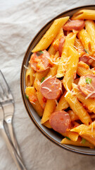 Homemade One-pot Hot Dog Pasta in a Bowl, top view. Flat lay, overhead, from above. Close-up.